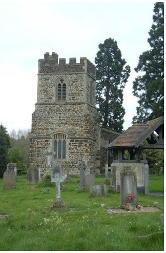 The twelfth century tower of St Mary's Old Linslade among gravestones